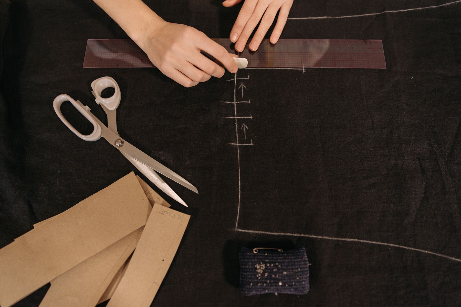 Bib and strap pieces for an overalls sewing pattern arranged before construction